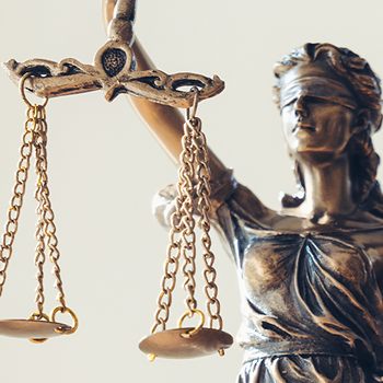 Lady Justice holding balanced scales.